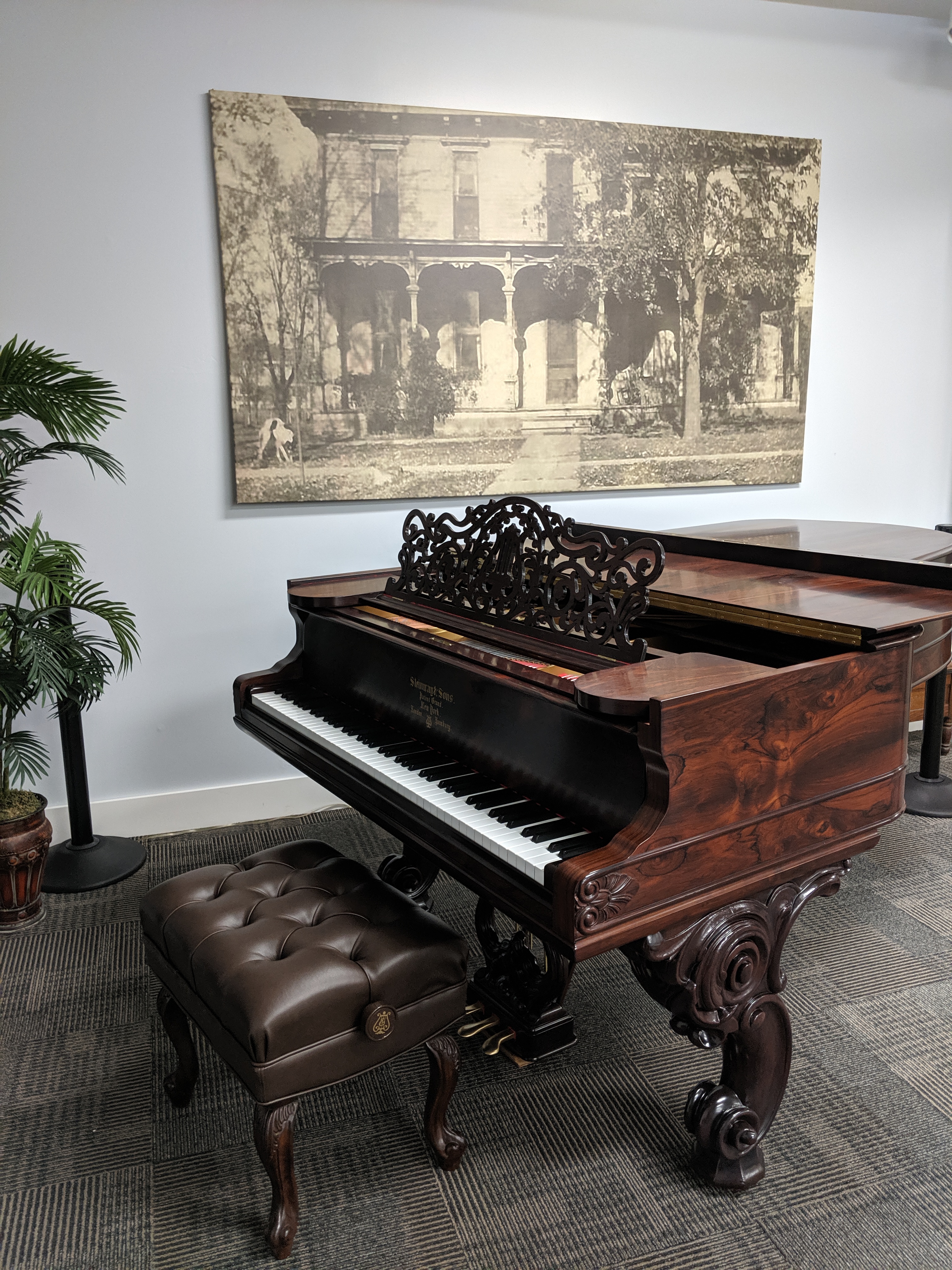 1877 Steinway piano with a photo of the Dr. Elliott Pyle home in the background.
